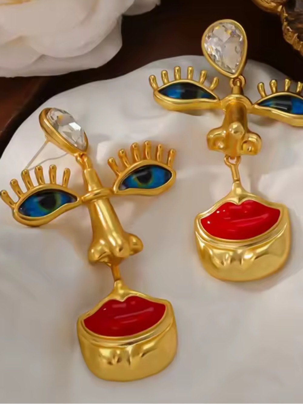 Anthropologie Gold Face Drop Earrings with Red and Blue Accents